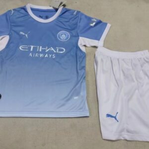 Conjunto Niño Manchester City temporada 26/27 Primera equipación