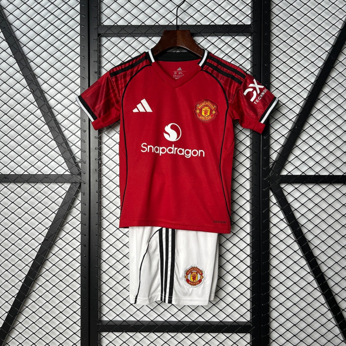 Conjunto Niño Manchester United temporada 25/26 Primera equipación