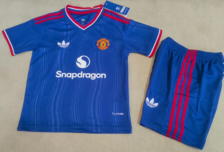 Conjunto Niño Manchester United temporada 26/27 Segunda equipación